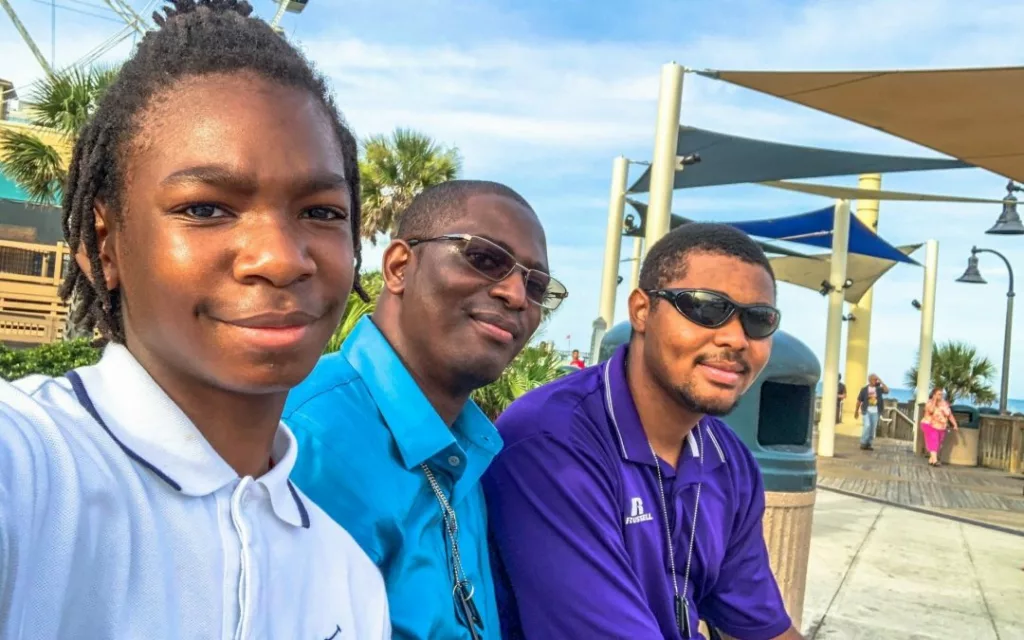 Antowan, Aidan, and Aric smiling together